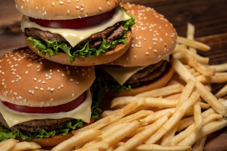 Hamburger stacked on a dark table backgroundの写真素材