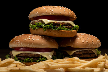 Hamburger stacked on a dark table backgroundの写真素材
