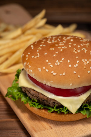 Hamburger and french fries on the tableの写真素材