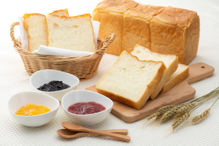 Bread and jam on the tableの写真素材