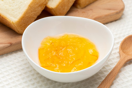 Orange marmalade jam on the tableの写真素材