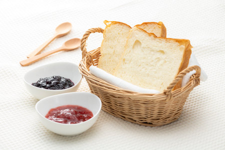 Bread and jam on the tableの写真素材