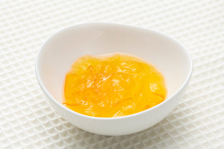 Orange marmalade jam on the tableの写真素材