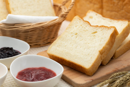 Bread and jam on the tableの写真素材