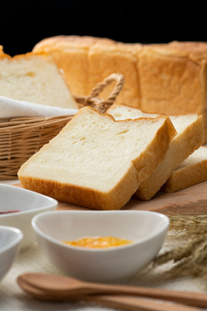 Bread and jam on the tableの写真素材