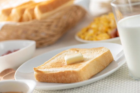 Bread and butter on the breakfast tableの写真素材