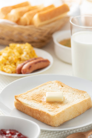 Bread and butter on the breakfast tableの写真素材