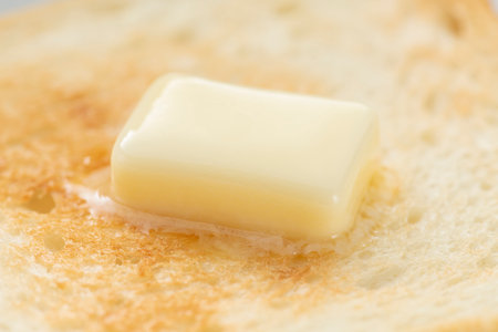Butter melted on toasted breadの写真素材