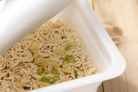 Add hot water and eat instant cup yakisobaの写真素材