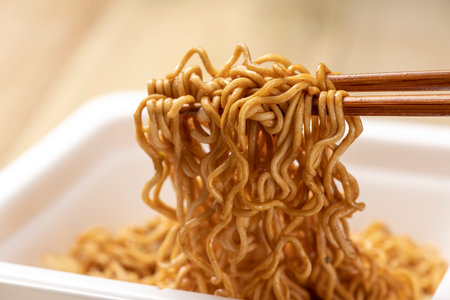 Add hot water and eat instant cup yakisobaの写真素材