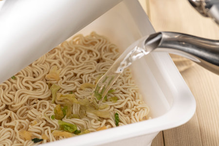 Add hot water and eat instant cup yakisobaの写真素材