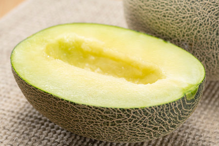 Close up of cut green melonの写真素材