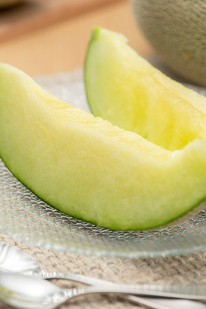 Fresh green melon cut on the tableの写真素材