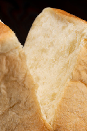 Shred freshly baked bread by handの写真素材