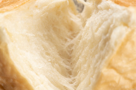Shred freshly baked bread by handの写真素材