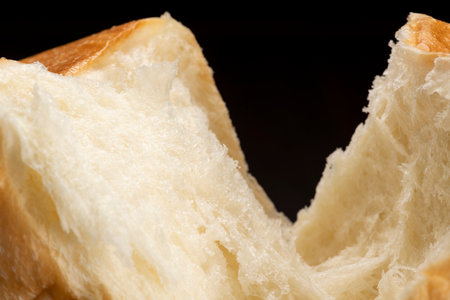 Shred freshly baked bread by handの写真素材