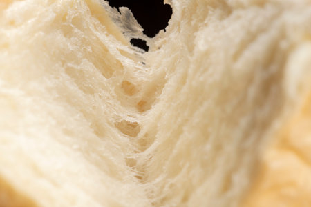 Shred freshly baked bread by handの写真素材