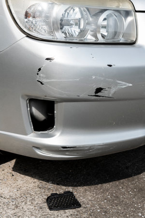 Scratches or dents on the car bumper. Car accident. Car insurance.の写真素材