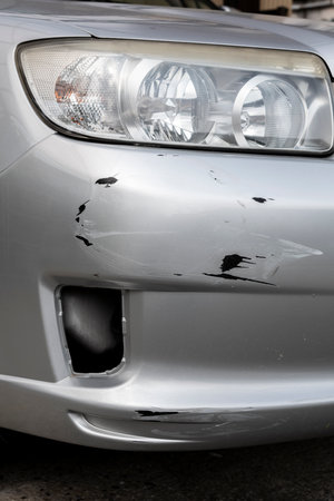Scratches or dents on the car bumper. Car accident. Car insurance.の写真素材