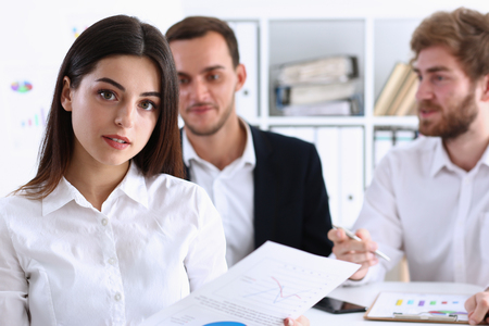 Beauty Businesswoman holding clipboard with paper fo notes on backround two peoples smiling aducation and discussingの写真素材