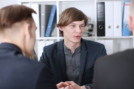 Group of people deliberate on problem with clipboard pad closeup. White collar check money papers, stock exchange market, earnings list, partnership agreement idea discussion, startup conceptの写真素材