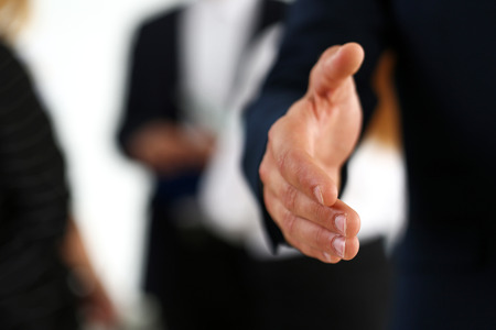 Businessman offer hand to shake as hello in office closeup. Serious business, friendly support service, excellent prospect, introduction or thanks gesture, gratitude, invite to participate conceptの写真素材