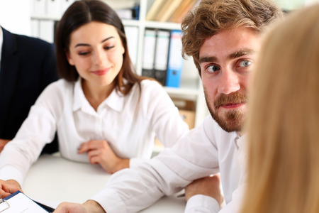 Group of people sit in office deliberate on problem portrait. White collar talk and listen, idea discuss, profit review, sale market debate, train, lawyer document study, finance adviser job conceptの写真素材