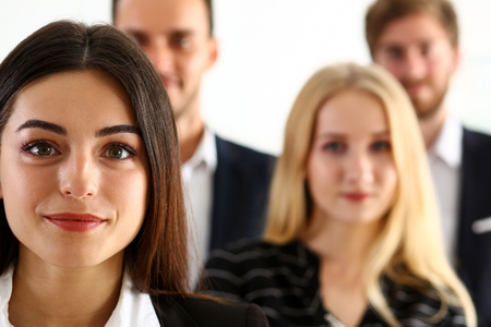 Group of smiling people stand in office looking in camera portrait. White collar power, mediation solution project, creative advisor participation, profession train, bank lawyer, client visit conceptの写真素材