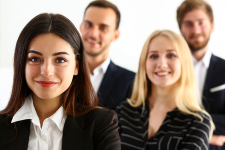 Group of smiling people stand in office looking in camera portrait. White collar power, mediation solution project, creative advisor participation, profession train, bank lawyer, client visit conceptの写真素材