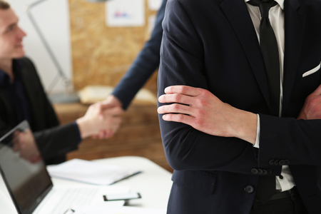 Hands of businessman at workplace crossed on chest. White collar worker at workspace shake hands, exchange market, job offer, certified public accountant, internal Revenue officer conceptの写真素材