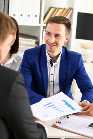 Group of people sit in office deliberate on problem portrait. White collar talk and listen, idea discuss, profit review, sale market debate, train, lawyer document study, finance adviser job conceptの写真素材