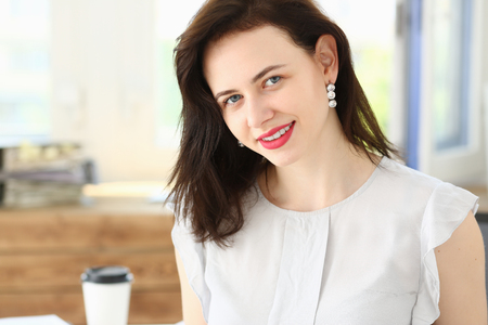 Beautiful smiling businesswoman portrait at workplace look in camera. White collar worker at workspace, exchange market, job offer, certified public accountant, internal Revenue officer conceptの写真素材
