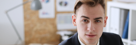 Handsome smiling businessman in suit portrait at workplace. White collar worker at workspace, exchange market, job offer, certified public accountant, internal Revenue officer conceptの写真素材