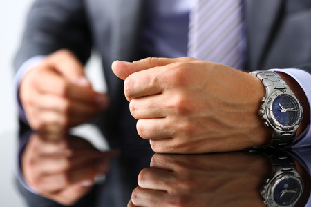 Empty arms of man in suit and tie closeup. White collar, banker time, watch, wristwatch, patience, make decision, strong control, head of the board council conceptの写真素材