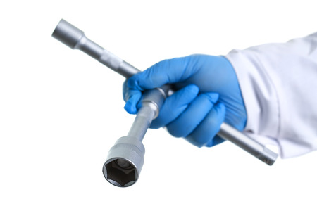 The key for the car repair man holding in his hand. Isolated on white.の写真素材