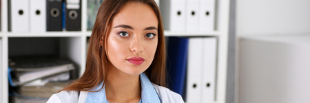 Beautiful smiling female doctor in officeの写真素材
