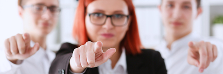 A group of business people pointing theirの写真素材