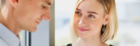 Beautiful woman portrait at workplace examiningの写真素材