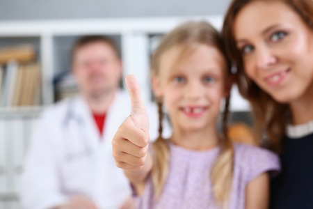 Smiling little child medicine and doctorの写真素材