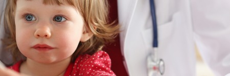 Little child at pediatrician receptionの写真素材