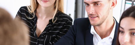 Smiling man in suit shake hands as helloの写真素材