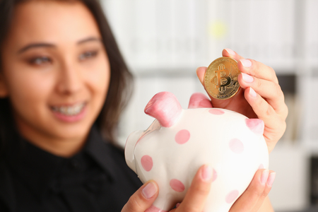 A young smiling chinese woman holdingの写真素材