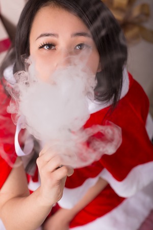 A Chinese woman in a Santa suitの写真素材