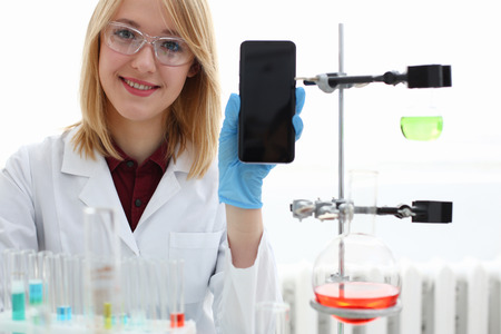 A female doctor in a chemical laboratory holdsの写真素材