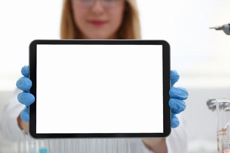 A female doctor in a chemical laboratory holdsの写真素材