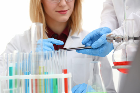 A female doctor in a chemical laboratory holdsの写真素材