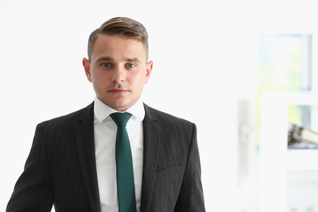 Handsome man in suit and tie look in camera chestの写真素材