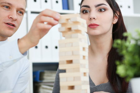 Businessman plays in a strategy of block game