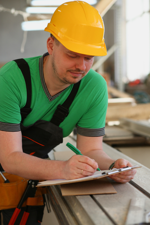 Portrait of young attractive man in workの写真素材