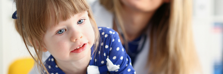 A small child is afraid in the hospital room